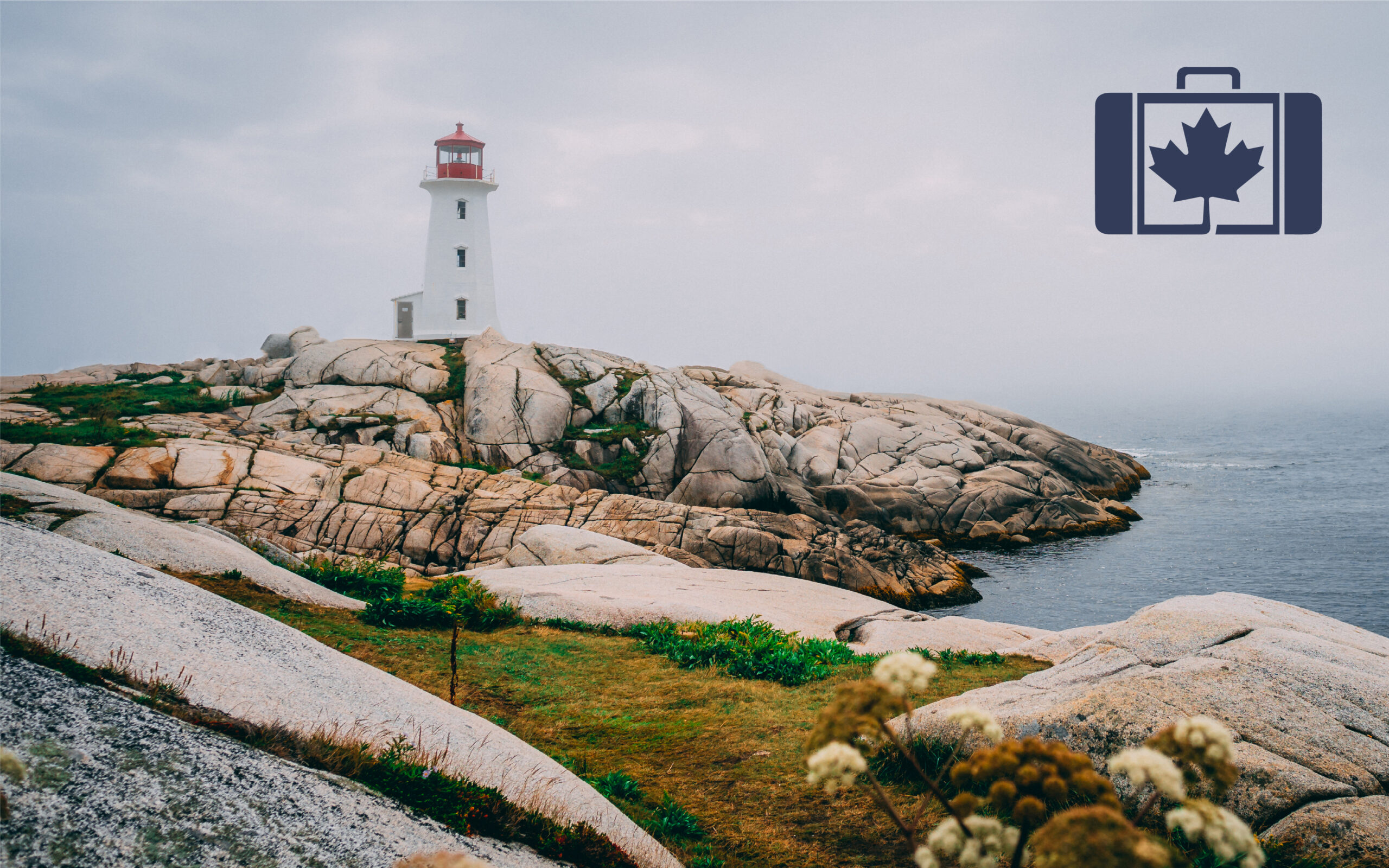 VisitorsInsurance.ca A photograph of a red lighthouse surrounded by rugged coastal rocks under a gloomy sky.