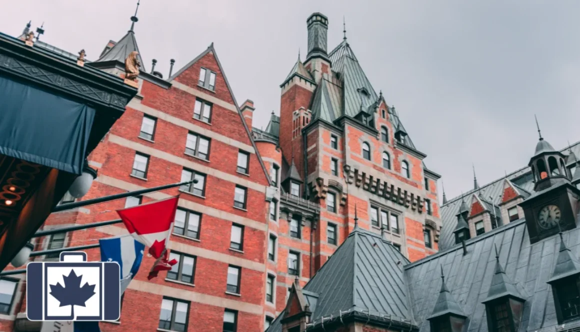 VisitorsInsurance.ca Low-angle view of the iconic Château Frontenac in Quebec City, displaying its historic red brick architecture and green copper turrets. Canadian and Quebec flags wave in the foreground.